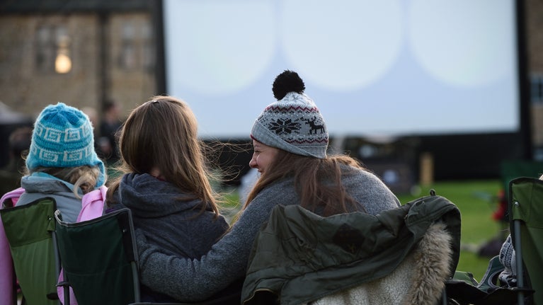Visitors attending a cinema experience at Hardwick, Derbyshire.